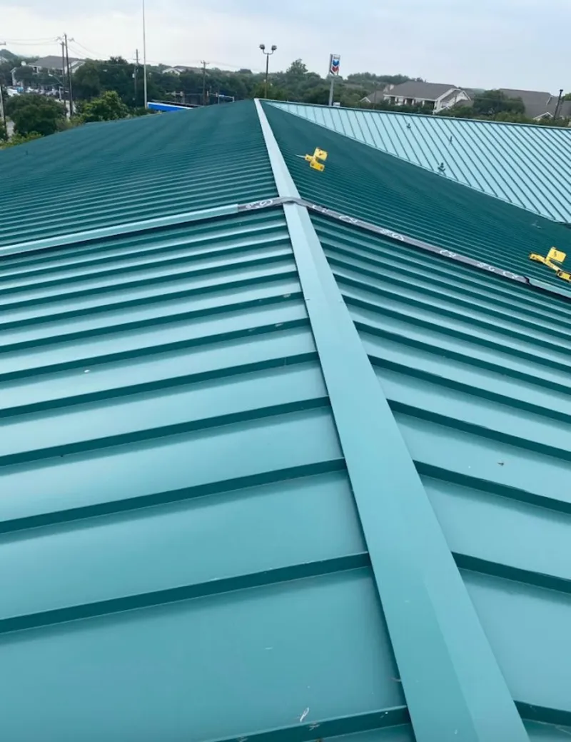 Green commercial metal roof ridge and valley for Metal Roof Repair in Volney